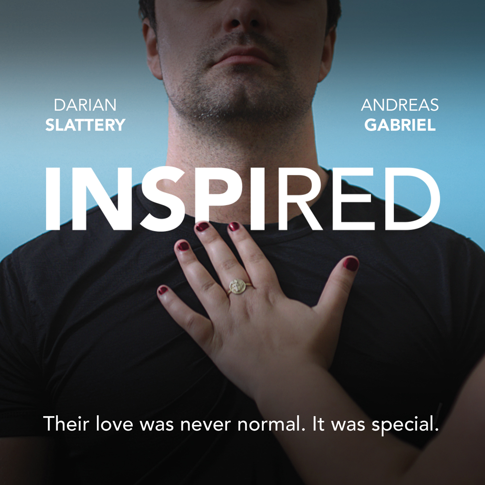 A hand with fingers spread, palm facing a person's chest with a text overlay that reads "Darian Slattery, Andreas Gabriel. Inspired. Their love was never normal. It was special."