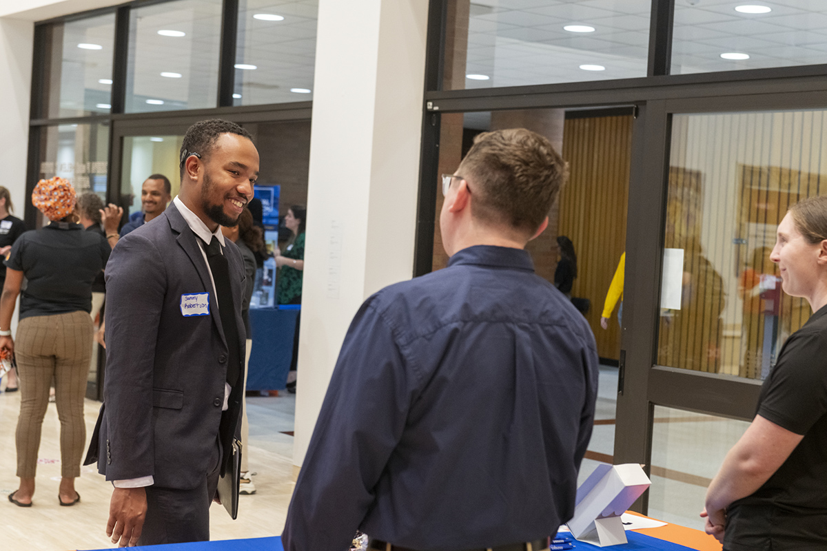 Students meet and converse with employers at the career fair