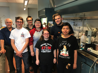 Photo of Schmitthenner and 6 students standing in lab