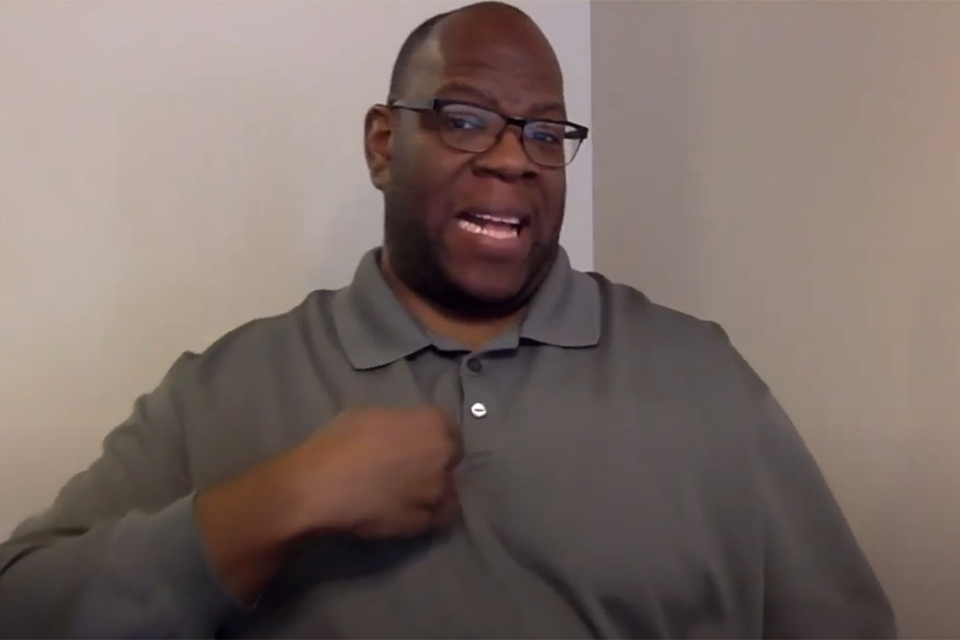Man signing to camera about SAISD facts week topic of binge drinking.