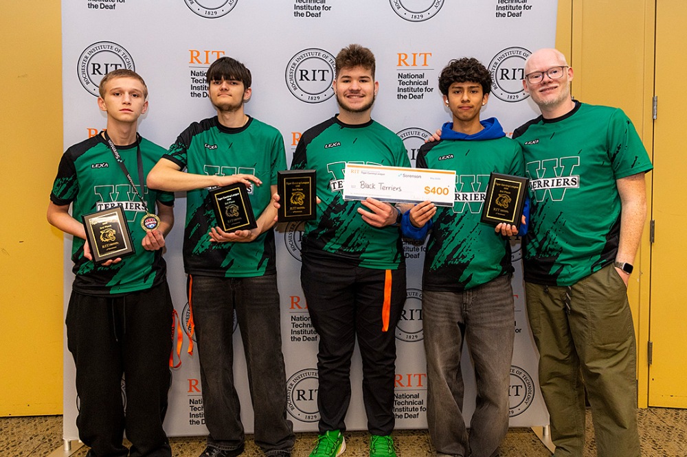 Third-place esports team 'Black Terriers' wearing green athletic shirts holding plaques and a $400 prize check.