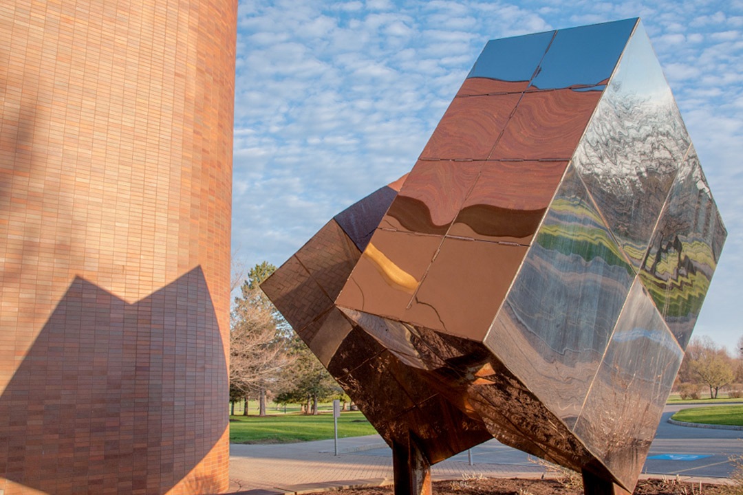 photo of cube sculpture in front of lbj