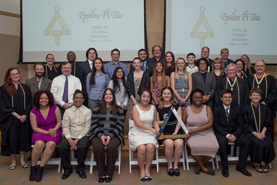 inductees into honor society posing for a photo.