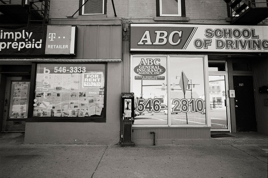 a payphone outside of the ABC School of Driving.