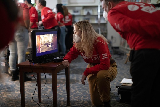 student watching the playback of a movie scene on a TV.