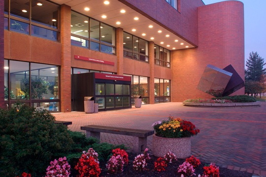 exterior of a brick building at dusk.
