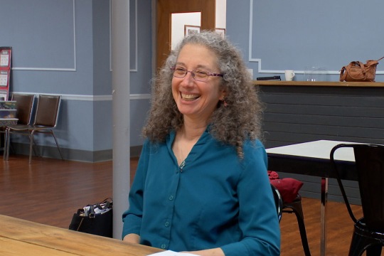 Diana Pryntz sitting at table.