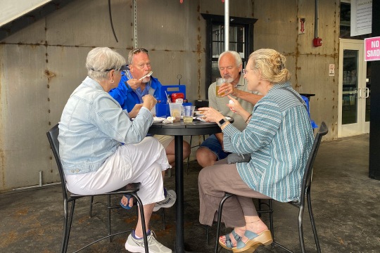 RIT/NTID alums were sitting at the table, enjoying their appetizers/beverages and chatting. Photo credit: Sara Smania