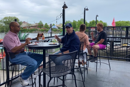RIT/NTID alums were sitting at the table, enjoying their appetizers/beverages and chatting. Photo credit: Sara Smania