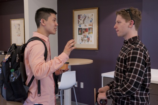 Two students discussing a project