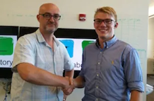 Brennan Terhune-Cotter and Matthew Dye in the lab