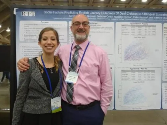 Sarah Kimbley and Matt Dye in front of her project presentation