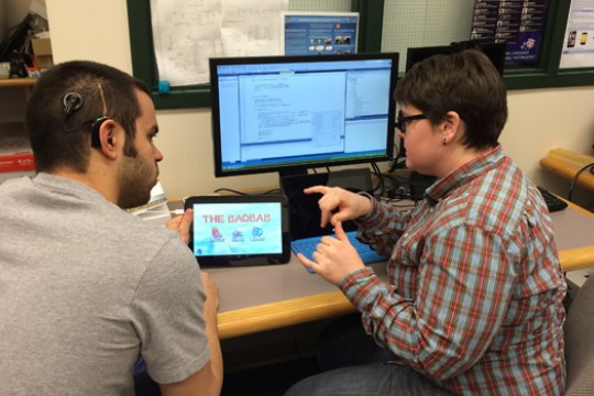 People working on devices