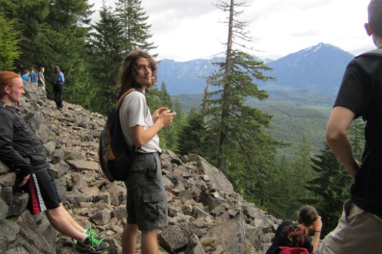People posing near mountain