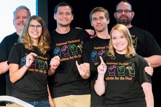 People gathered for picture on stage