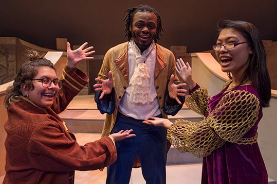 Three people in costume for Beauty and the Beast.