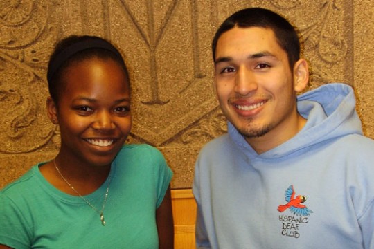 Two people posing for camera