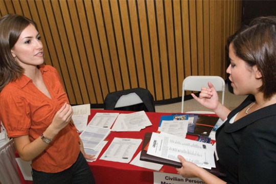 Student talking to person about project