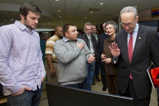 People gathered around display