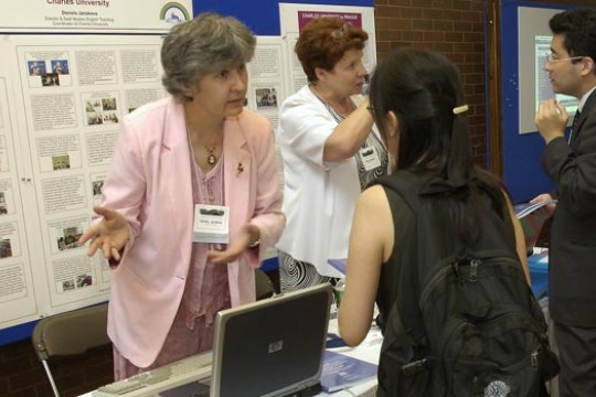 Person explaining presentation to student