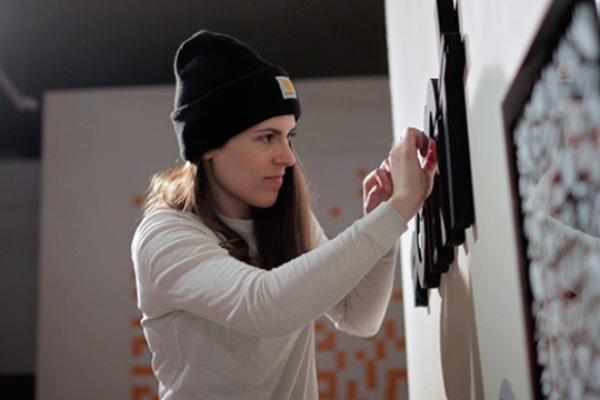 Person handing word on wall