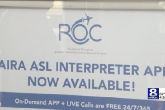 a sign advertising A S L interpreting at the Rochester airport.