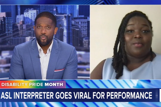 News anchor interviews ASL interpreter remotely with headline ASL Interpreter Goes Viral for Performance and Disability Pride Month banner.