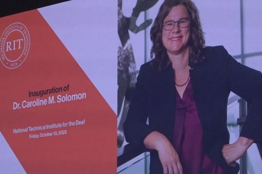 a headshot of Caroline Solomon appears on screen next to her name and title.