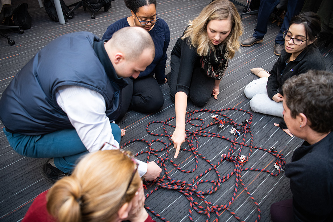 Students doing an activity with rope.