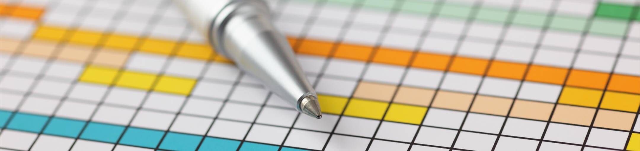 A pen lines on a gridded sheet of paper with colored in squares of various colors.