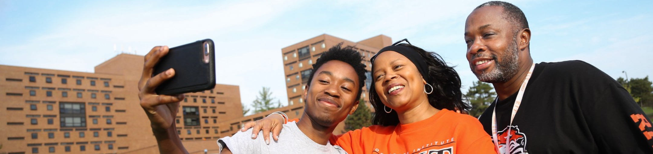 A family taking a selfie during orientation at RIT.