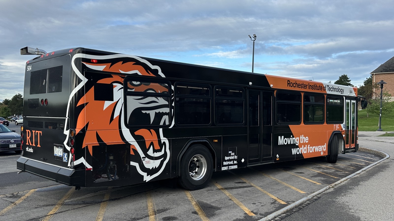 orange and black bus with tiger on it