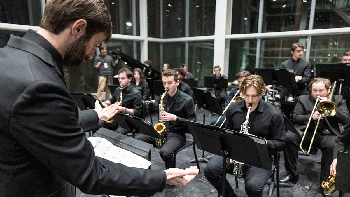 a jazz group playing saxophones and trombones.