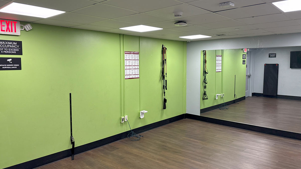 a studio room with a mirrored wall.