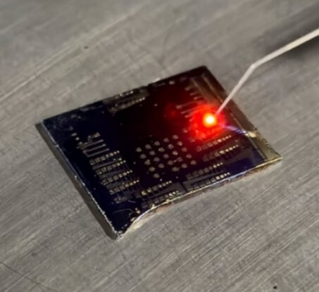 A laser being focused on a chip.