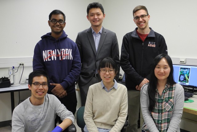 Team of five researchers poses.