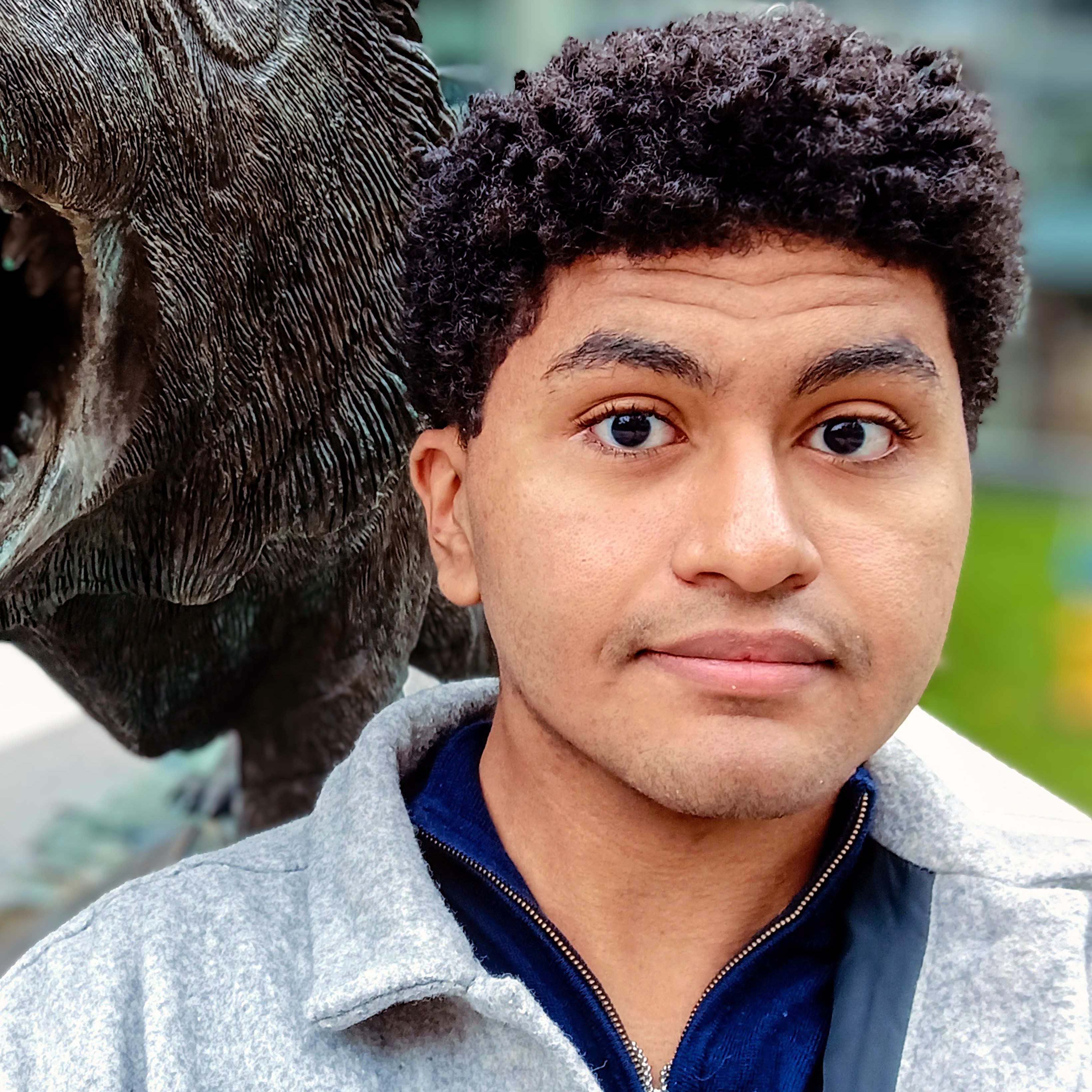 Sam in front of the RIT tiger statue