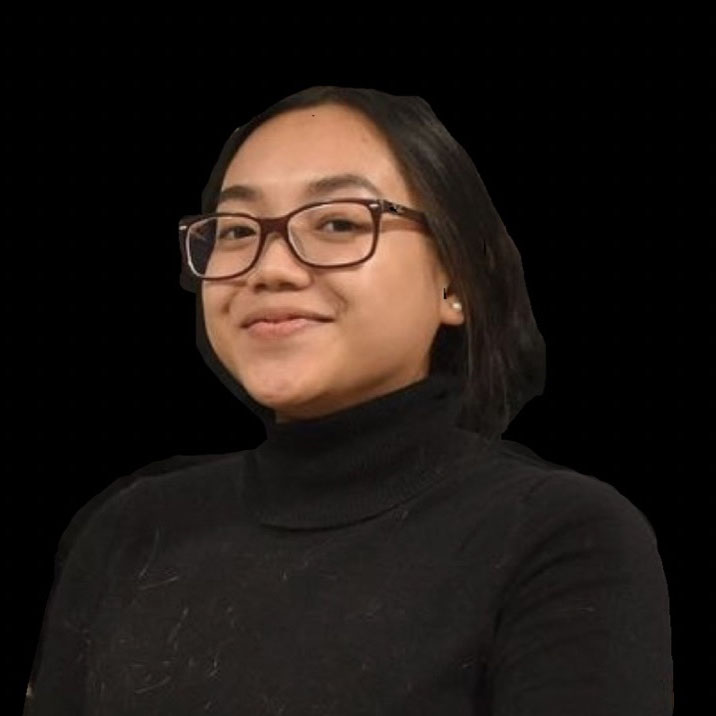 Carmella in front of a black background.