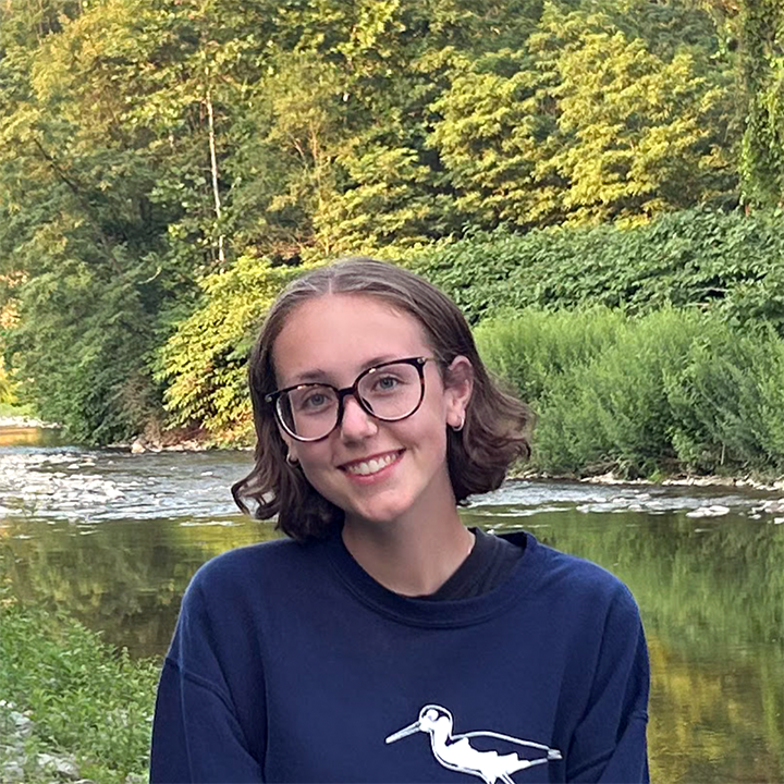 Noelle in front of water