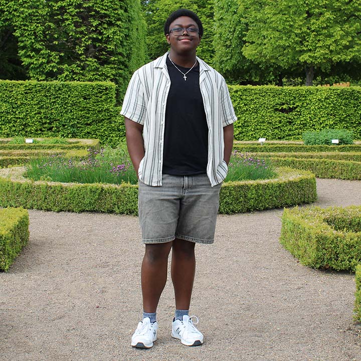 Edward standing in a garden.