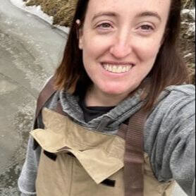 Nikki Fuller smiling, wearing waders.