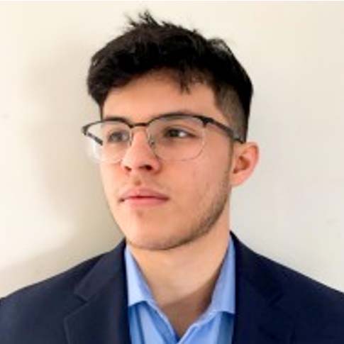 Ray in front of a white backdrop.