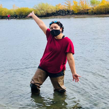 Rocky standing in water wearing a mask.
