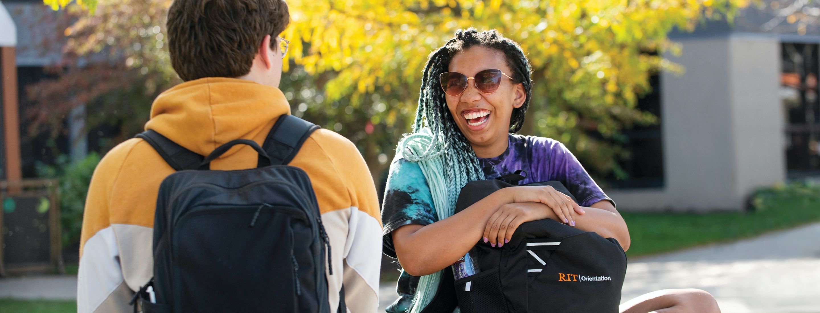 A group of students wearing masks using a cordless drill.