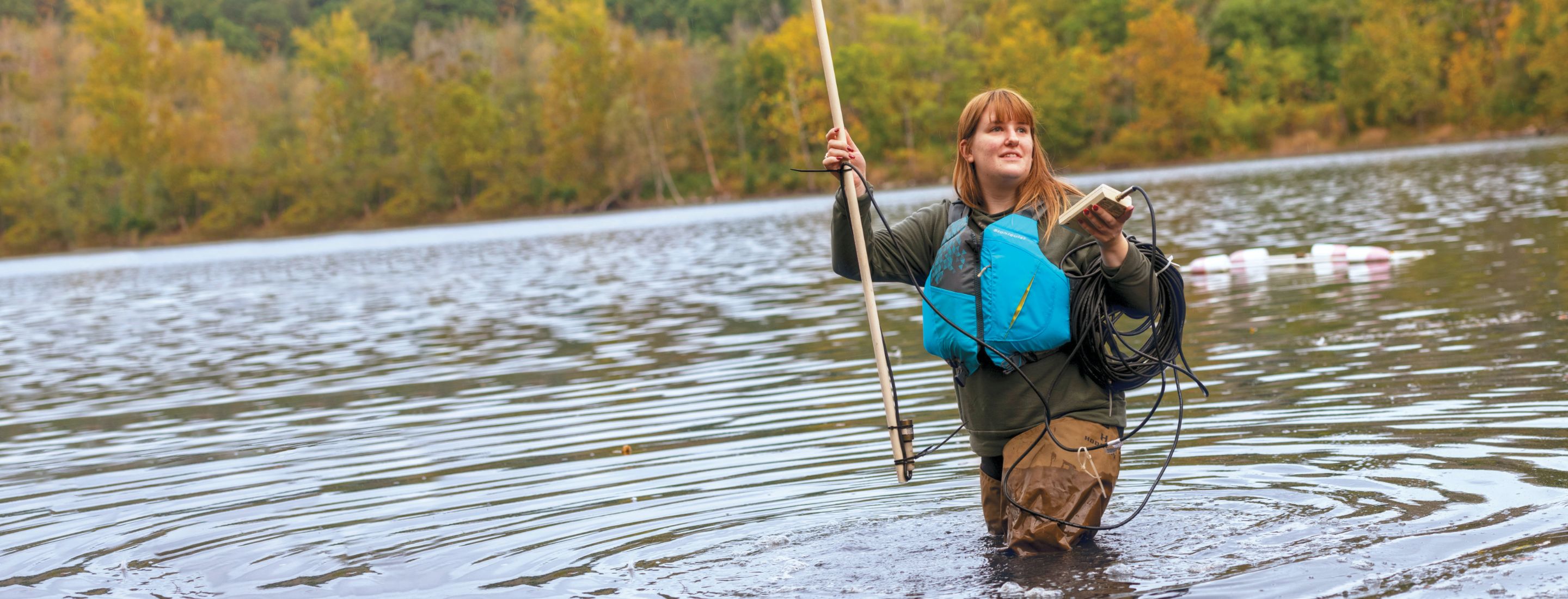 Gloved hands working in a hydroponic farm