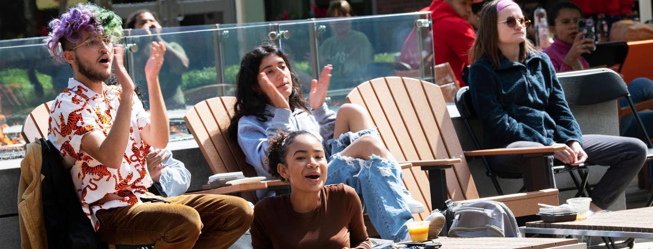 A group of students wearing masks using a cordless drill.