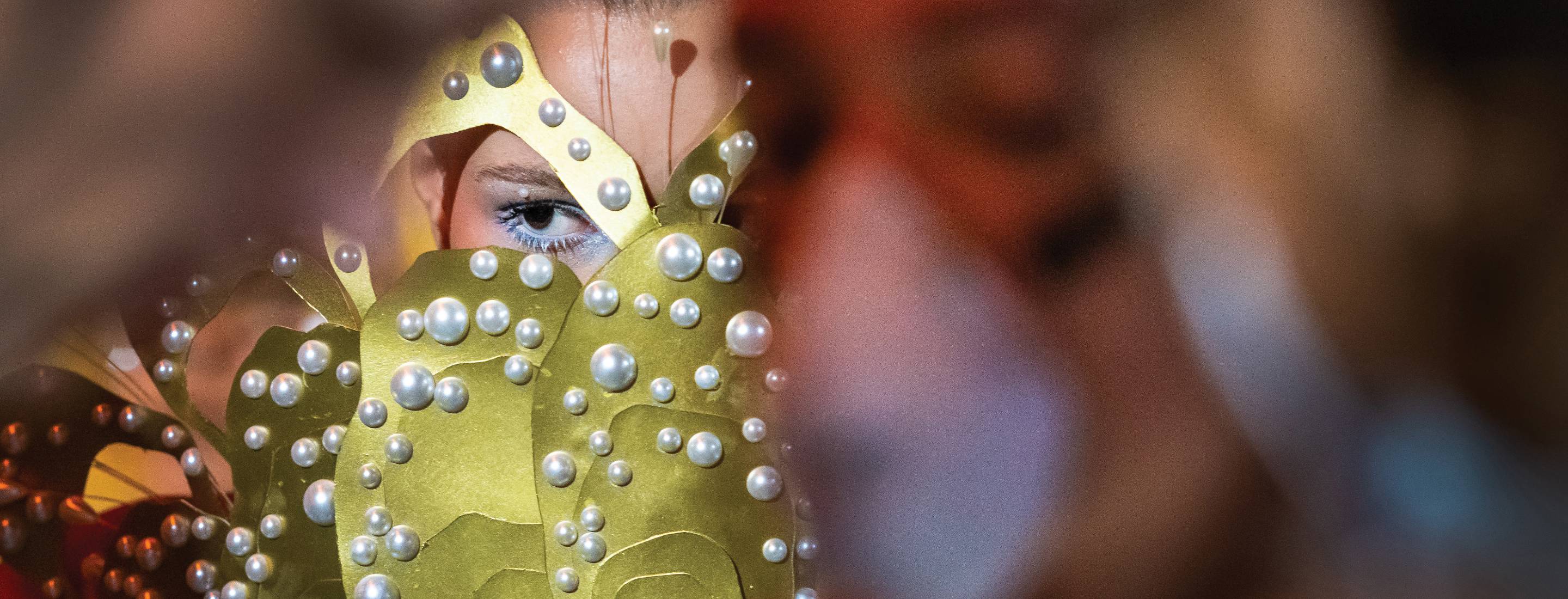 A group of students wearing masks using a cordless drill.