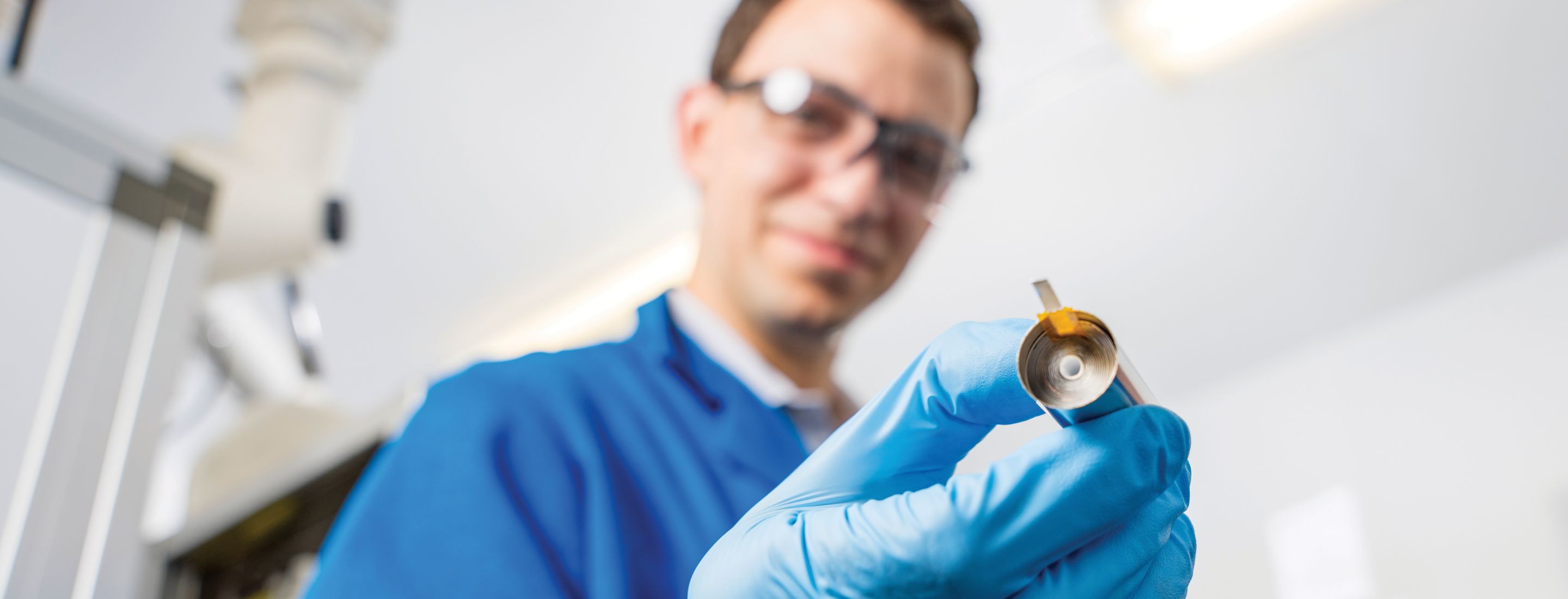 Gloved hands working in a hydroponic farm