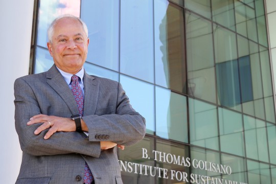 Nabil Nasr with glass wall and GIS name in background