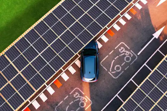 overhead view of electric vehicle parking under solar panels.
